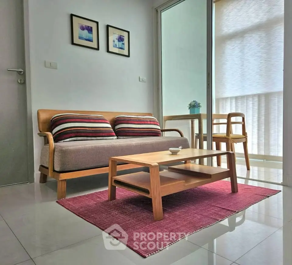 Modern living room with stylish furniture and natural light, perfect for cozy relaxation.