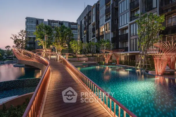 Luxurious modern apartment complex with stunning illuminated pool and unique architectural design.