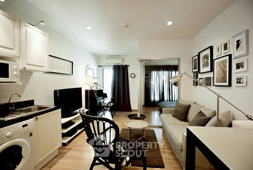 Modern living room with open kitchen layout and stylish decor