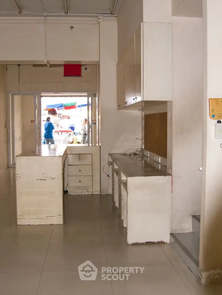 Spacious kitchen area with ample storage and open layout, ideal for culinary enthusiasts.