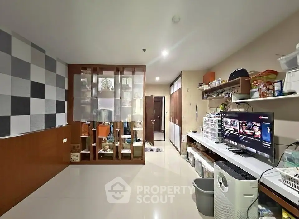 Modern living room with sleek storage and entertainment setup