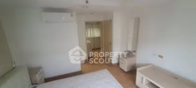 Spacious bedroom with air conditioning and modern furniture in a bright apartment.