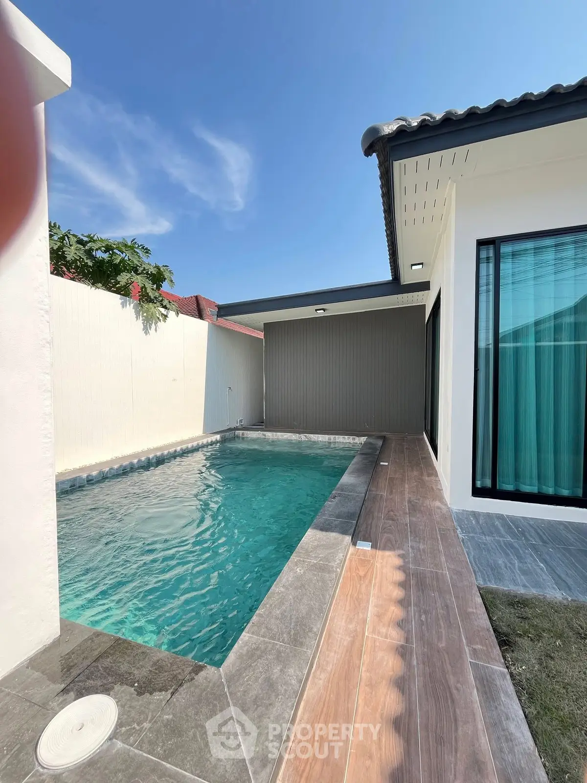 Modern home with private pool and sleek exterior design, perfect for luxury living.