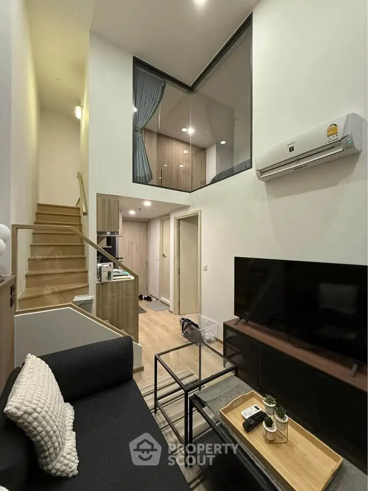 Modern duplex living room with high ceiling and stylish decor