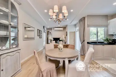 Elegant dining area with vintage decor and natural light in a cozy home setting.