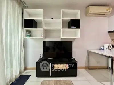 Modern living room with sleek TV stand and wall-mounted shelves