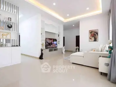 Spacious modern living room with elegant decor and ambient lighting