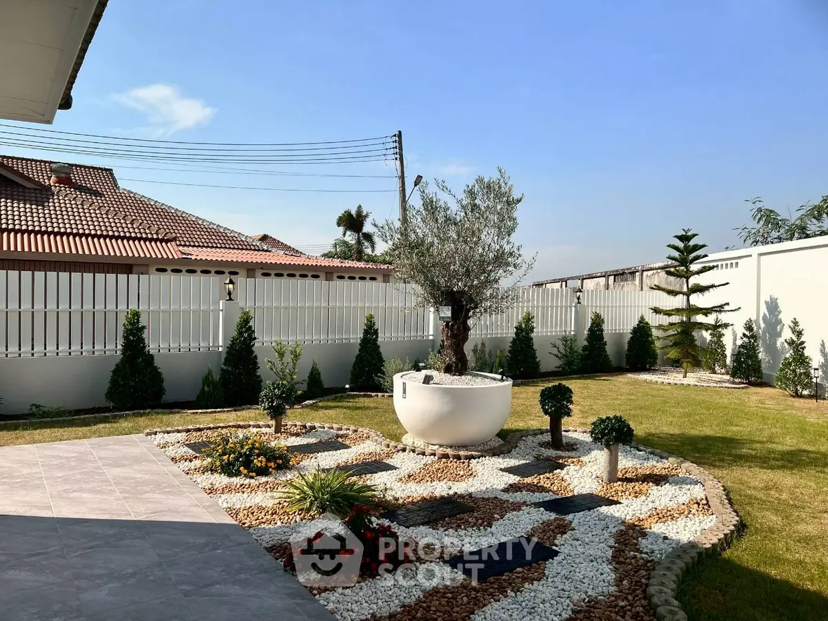 Beautiful landscaped garden with decorative stone pathways and lush greenery