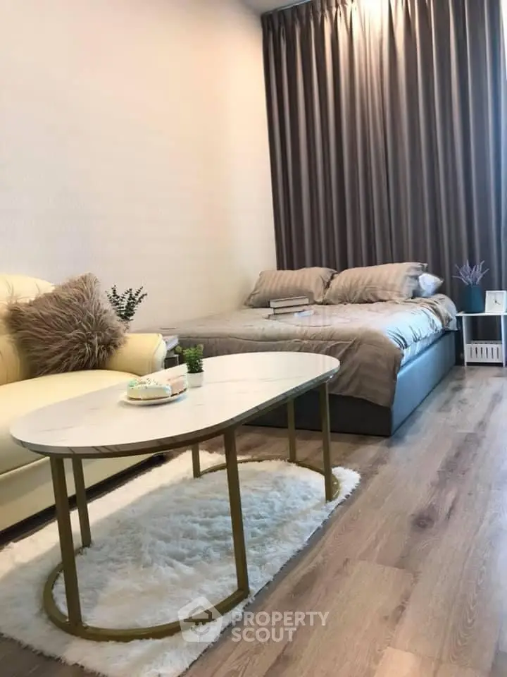 Cozy studio apartment with stylish decor and comfortable furnishings, perfect for modern living.