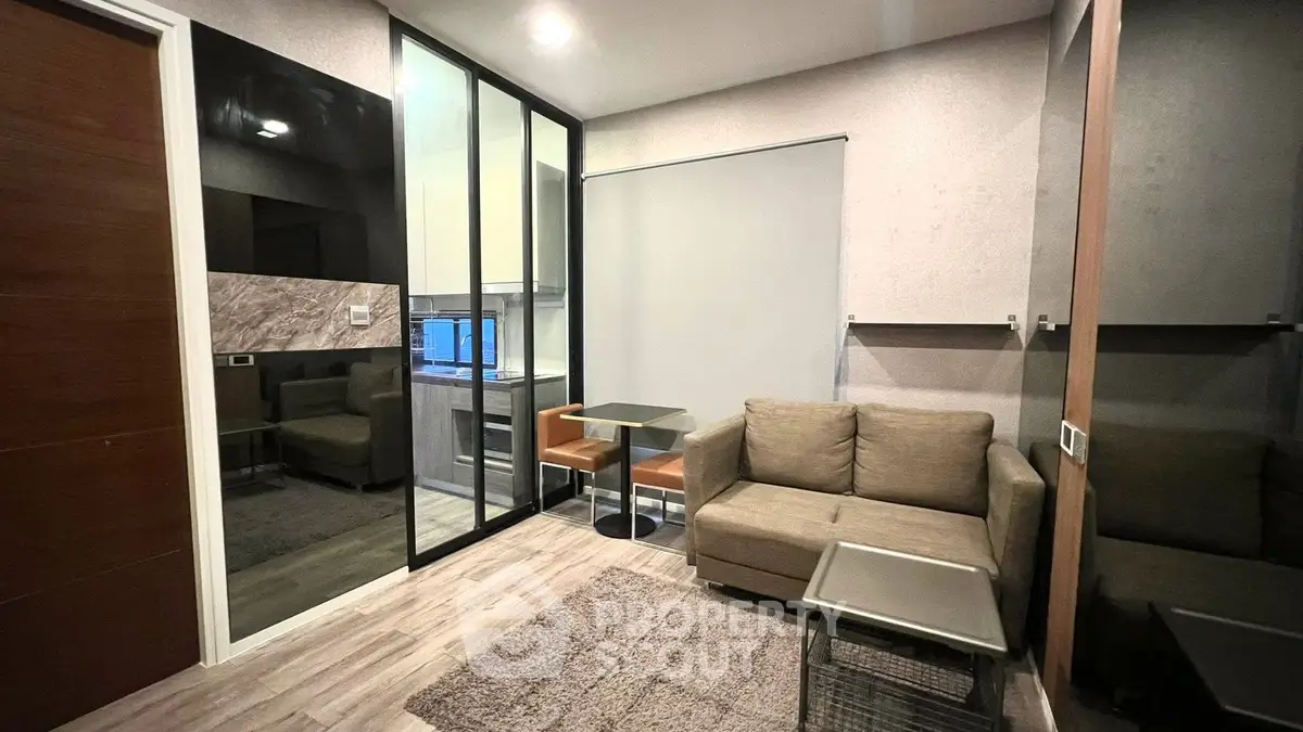 Modern living room with glass partition and cozy seating area
