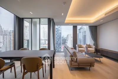 Luxurious modern living room with panoramic city views and elegant furnishings.