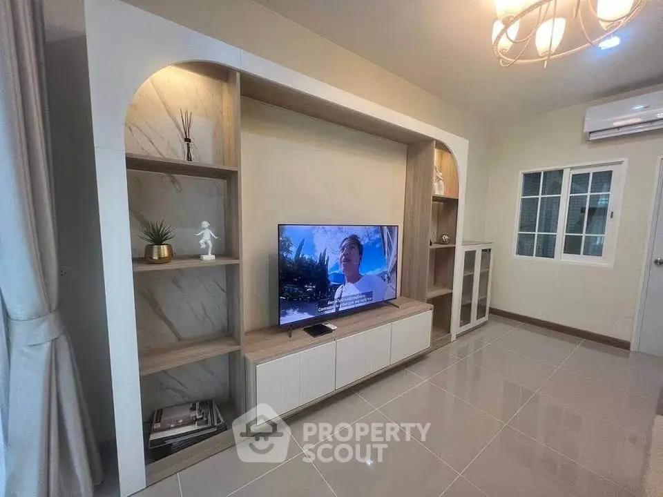 Modern living room with stylish built-in TV unit and elegant decor