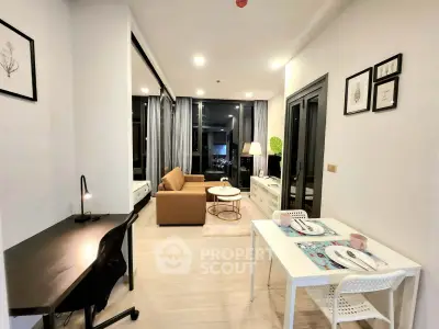 Modern living room with stylish decor and open layout, featuring a cozy sofa and dining area.