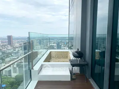 Luxurious high-rise balcony with stunning city view and modern glass railing.