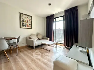 Modern living room with stylish decor and balcony access