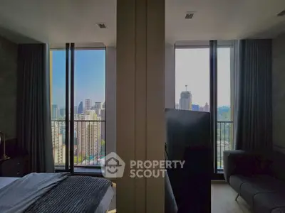 Modern bedroom with stunning city view from large windows and cozy interior design.