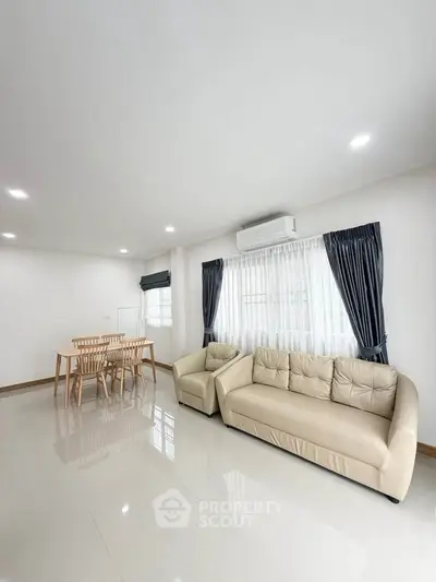 Spacious modern living room with elegant furniture and natural light