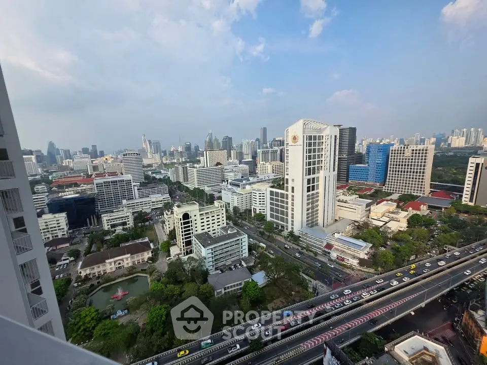 Stunning cityscape view from high-rise building showcasing urban skyline and bustling streets.