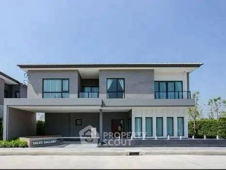 Modern two-story house with sleek design and spacious driveway