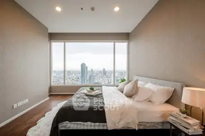 Luxurious bedroom with stunning city view and elegant decor