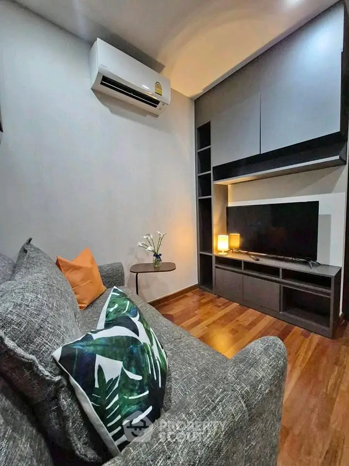 Modern living room with sleek furniture and air conditioning, perfect for cozy relaxation.