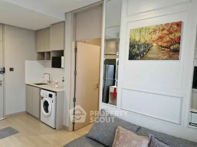 Modern apartment interior with washing machine and stylish decor