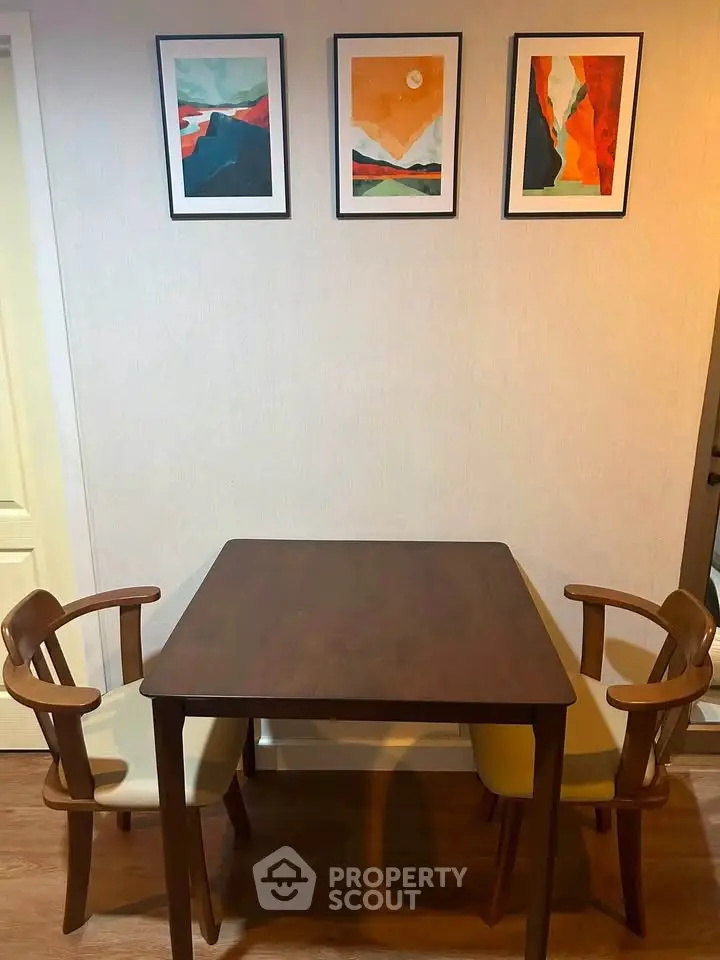 Cozy dining area with modern art and wooden furniture