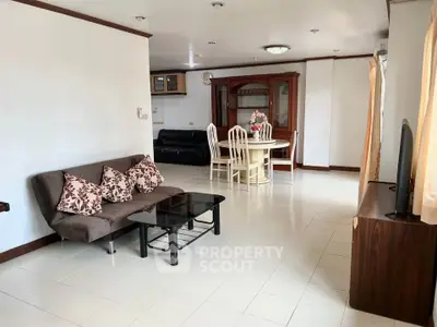 Spacious living room with modern furniture and dining area