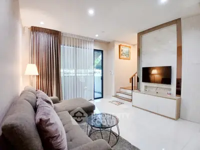 Elegant living room with modern decor and natural light