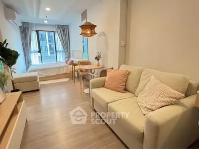 Modern studio apartment with cozy living area and stylish decor