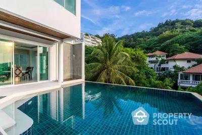 Luxurious villa with stunning infinity pool and lush tropical surroundings