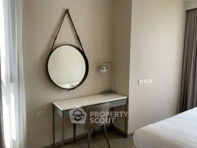 Modern bedroom with stylish mirror and sleek desk setup