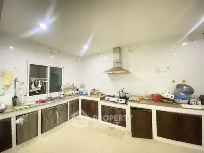 Spacious kitchen with ample counter space and modern appliances