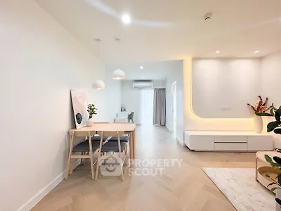 Modern living room with elegant dining area and stylish decor