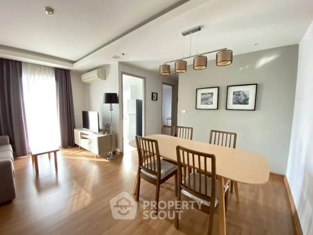 Spacious modern living room with dining area and natural light