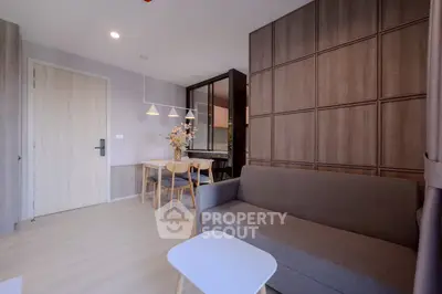 Modern living room with stylish furniture and elegant wooden paneling