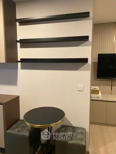 Modern living room with sleek wall shelves and stylish seating area