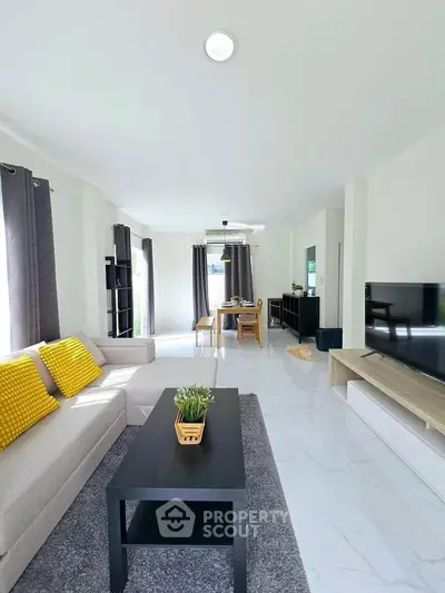 Spacious modern living room with sleek furniture and natural light