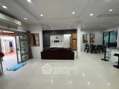 Spacious modern living room with open layout and elegant dining area