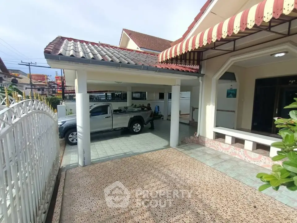 Charming suburban house with covered carport and tiled driveway