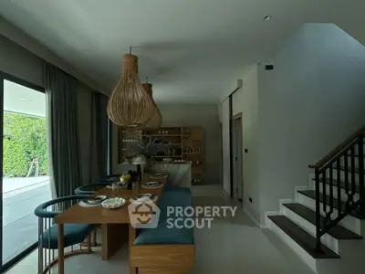 Modern dining area with stylish lighting and elegant decor