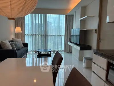 Modern living room with large windows and sleek furniture design