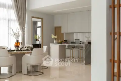 Luxurious open-plan kitchen and dining area with elegant decor and modern furnishings.