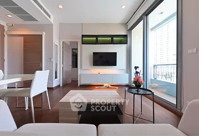 Modern living room with sleek furniture and balcony view in luxury apartment