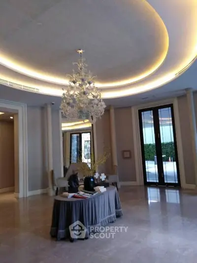 Luxurious lobby with elegant chandelier and modern decor