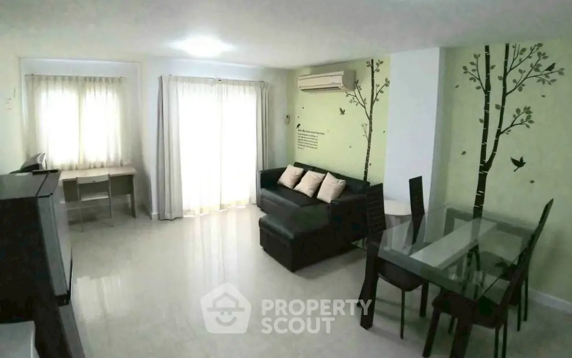 Spacious living room with modern decor and natural light