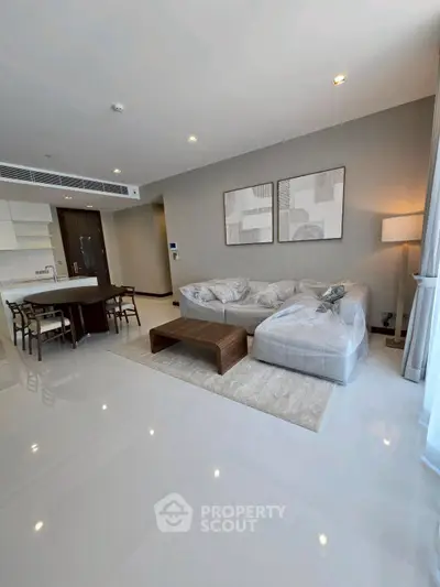 Spacious modern living room with open kitchen and elegant decor