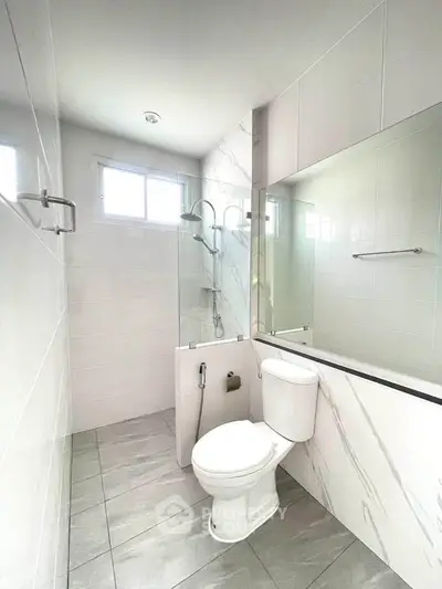 Modern bathroom with sleek design and large mirror
