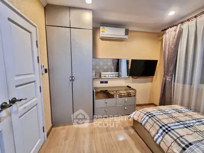 Cozy bedroom with modern decor and ample storage space