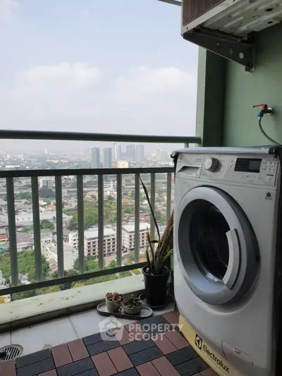 High-rise balcony with washing machine and city skyline view